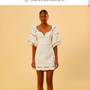 Darling white mini dress.  Euro flax design. Multi colored stitching.